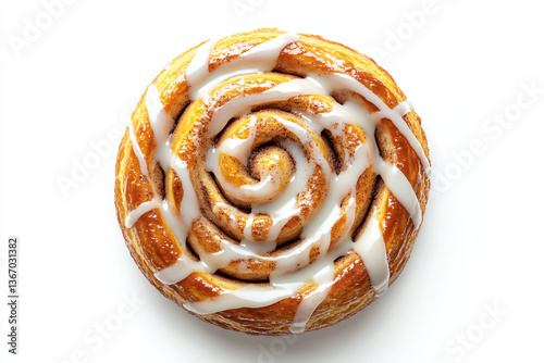 a cinnamon roll with icing on a white surface