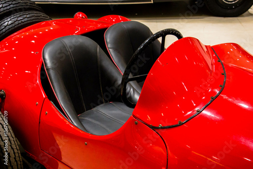Fototapeta Interior Close-Up of Classic Red Vintage Race Car with Black Leather Bucket Seat