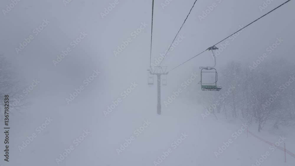 Ski Resort in Japan’s Alps – A snow-covered ski lift stretches over pristine slopes in a scenic Japanese mountain resort. Ski Resort in Japan’s Alps – A snow-covered ski lift stretches over pristine slopes in a scenic Japanese mountain resort.