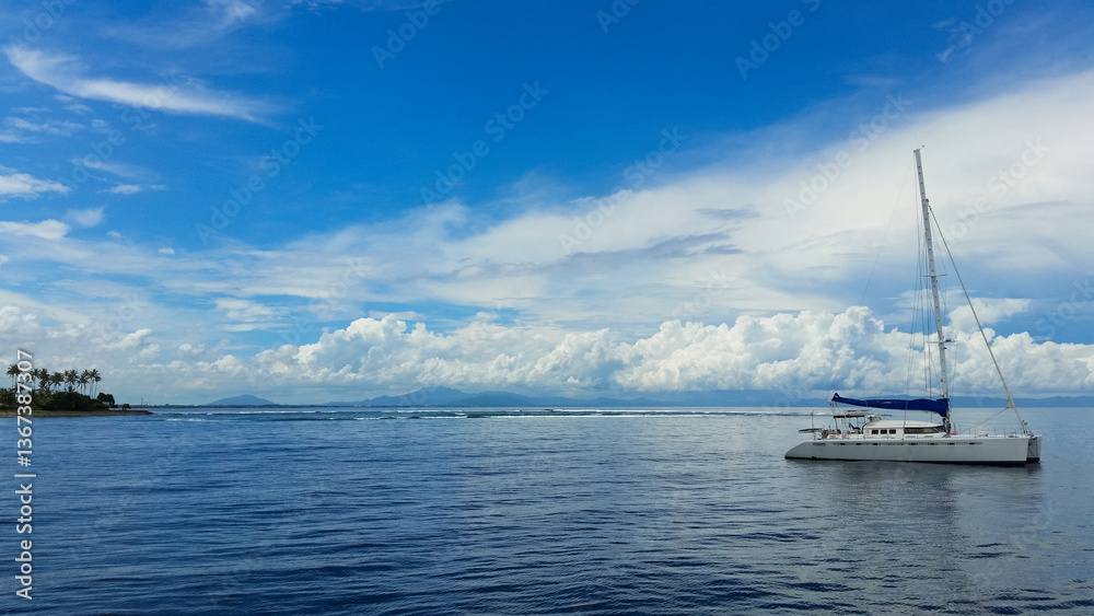 Fototapeta premium a beautiful ship is sailing in the blue sea
