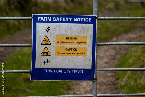 Sign on a farm gate in rural Ireland Farm safety notice 