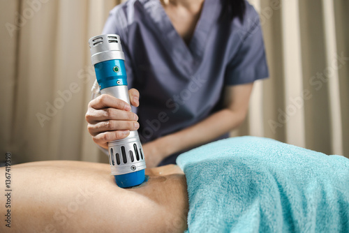 Shockwave physical therapy, shockwave therapy device is used in physical therapy to promote healing and relieve pain, showcasing professional approach to patient care