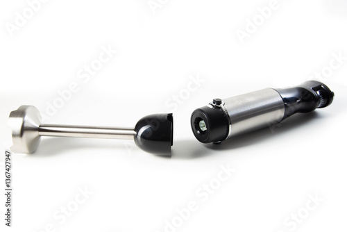 Modern immersion collapsible blender with a chopper on a white background, isolate. Household appliances, close-up