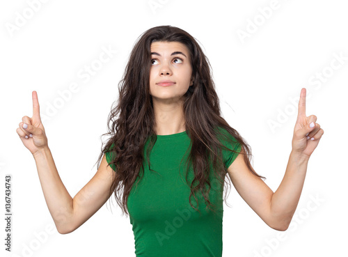 Happy young caucasian female in a shirt pointing fingers away