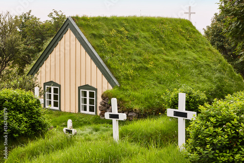 Obraz na płótnie Picturesque icelandic chapel with turf roof and cemetery. Hof, Iceland w salonie