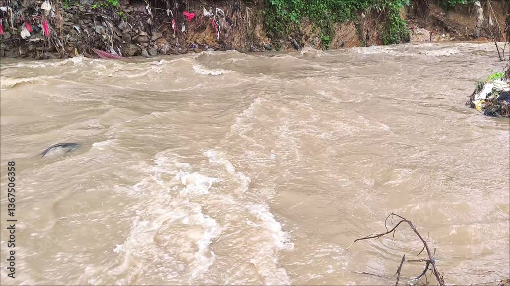 The rapid flow of river water is cloudy and dirty.
Nature concept. Water pollution.