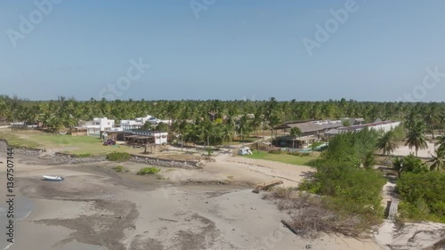 Tropical beach resort with kitesurf hotels, palm trees and lagoon in Ilha do Guajiru