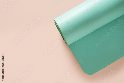 Obraz na płótnie Green foam yoga mat isolated on beige background. Relaxation and meditation concept. Accessories for yoga practice. Top view. Copy space. w salonie