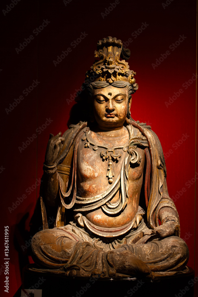 Buddha statue with a red background