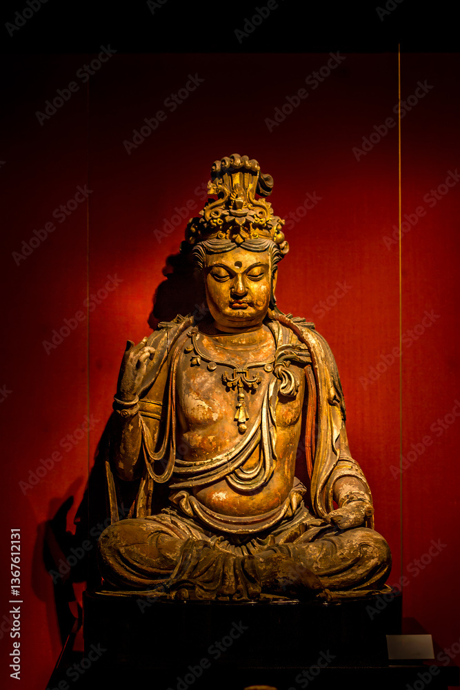Buddha statue with a red background