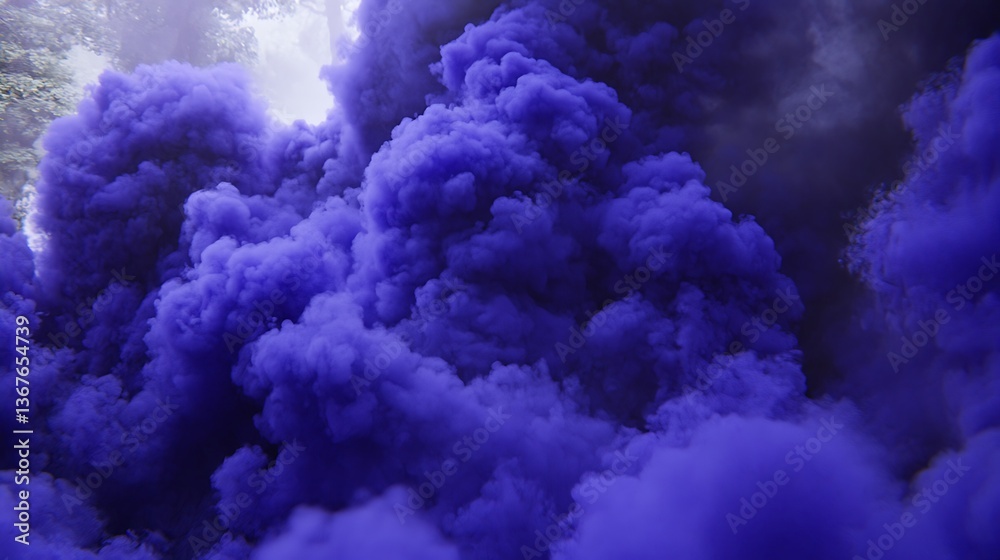 Naklejka premium Dense plumes of purple colored smoke billowing into the air