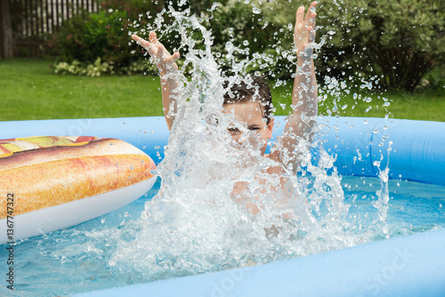 Obraz na płótnie Teenager plays, swims and swimming pool in summer. Eleven years year old boy splashing in pool. Outdoors. Summer fun vacation w salonie
