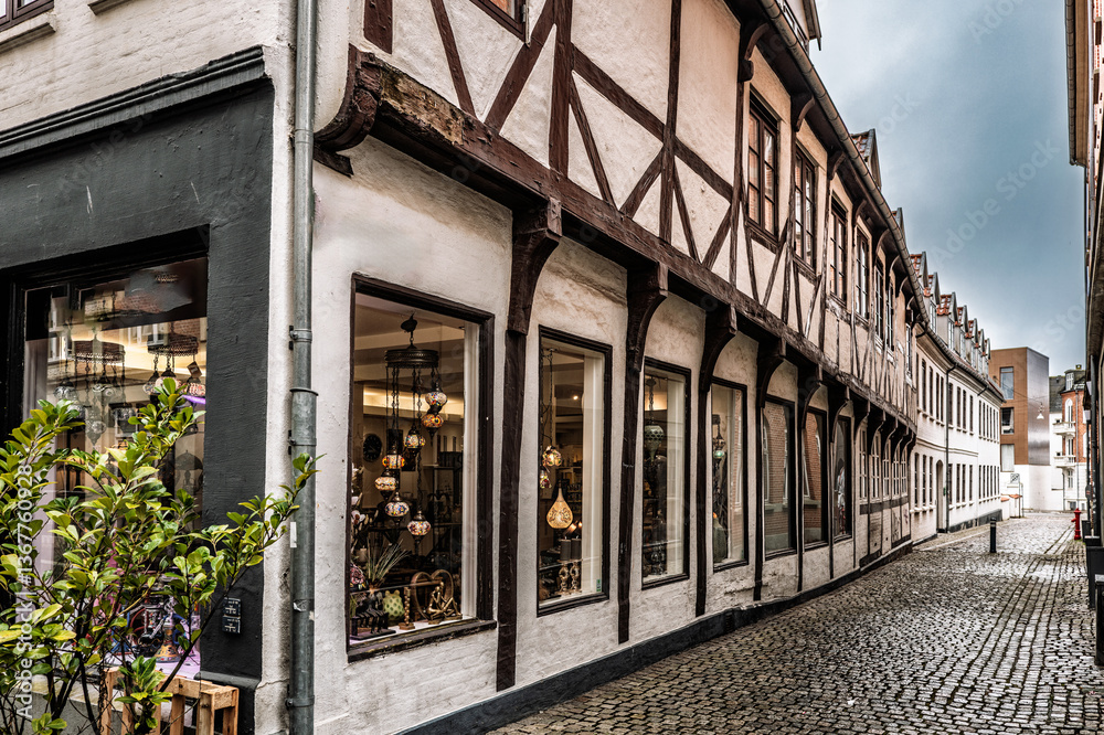 Fototapeta premium Charming Historic European Building on Narrow Cobblestone Street, Aalborg, Denmark