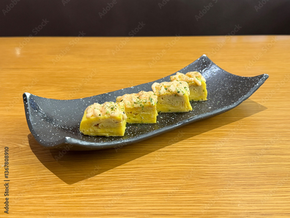 asian japanese sushi mentai cheese egg roll in long plate on wood table asian dim sum halal food restaurant cuisine banquet menu for cafe