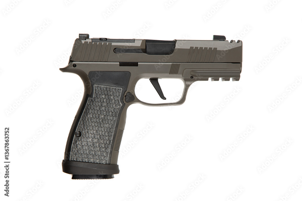 A semi-automatic handgun in khaki, featuring a textured grip and serrated slide, displayed on a clean white surface. A semi-automatic handgun in khaki, featuring a textured grip and serrated slide, displayed on a clean white surface.