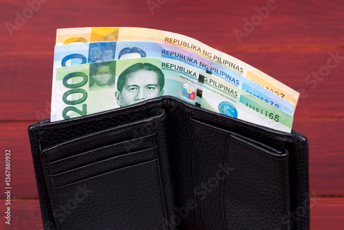 Philippine peso in the black wallet