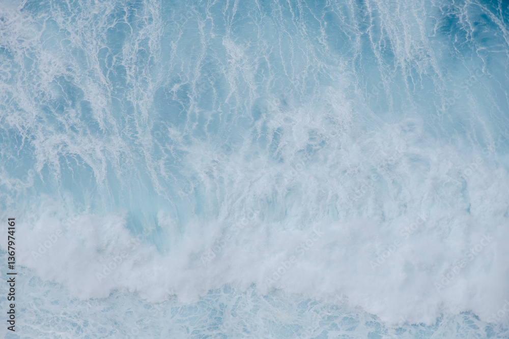 Fototapeta premium Huge crushing waves seen from above creating amazing textures.