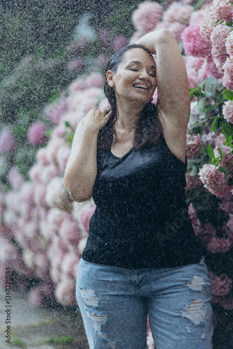 Beautiful woman in flowers in the rain. Fashion for plus size.