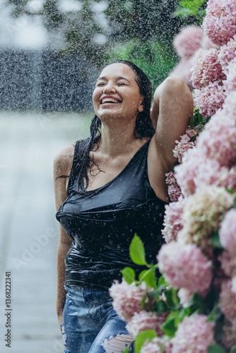 Beautiful woman in flowers in the rain. Fashion for plus size.