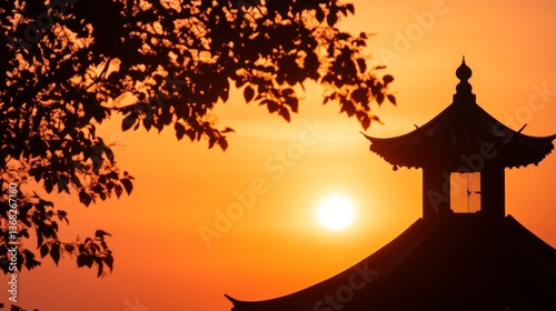 A serene sunset behind a traditional pagoda, framed by silhouette leaves and warm colors.