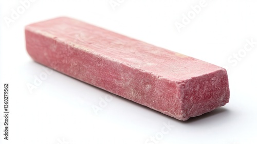 Close-up of a pink sidewalk chalk piece on a white background.