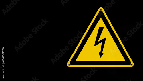 Triangular high voltage sign on a metal surface. A warning symbol of electrical danger. with a place for the text