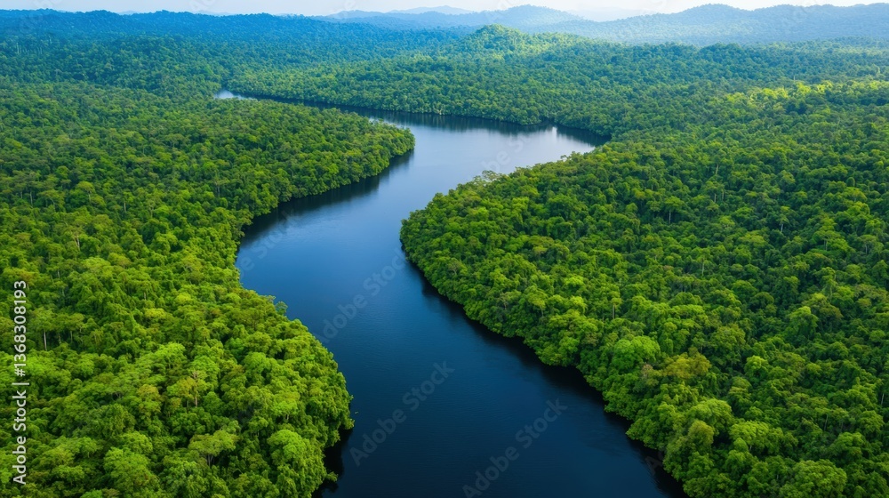 Aerial view of a winding river surrounded by lush green forests and mountains under a bright sky, showcasing the beauty of nature. Aerial view of a winding river surrounded by lush green forests and mountains under a bright sky, showcasing the beauty of nature.