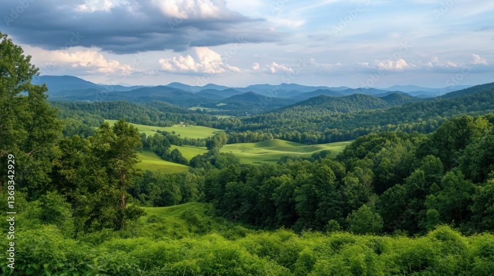 Fototapeta premium A panoramic view of a lush green mountain landscape under clouds