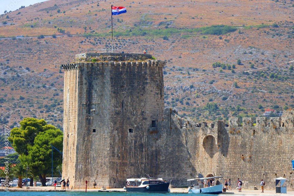 Historical Kamerlengo Fortress in Trogir, Croatia and Croatian flag.