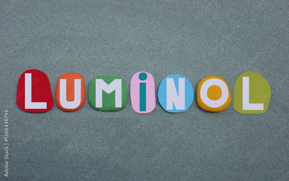 Fototapeta premium Luminol, chemical compound, luminol is most widely known for its application in forensic science, creative text composed with multi colored hand painted stone letters over green sand