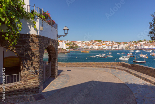 Obraz na płótnie Boats anchored in the harbor of Cadaques with white buildings in Spain w salonie