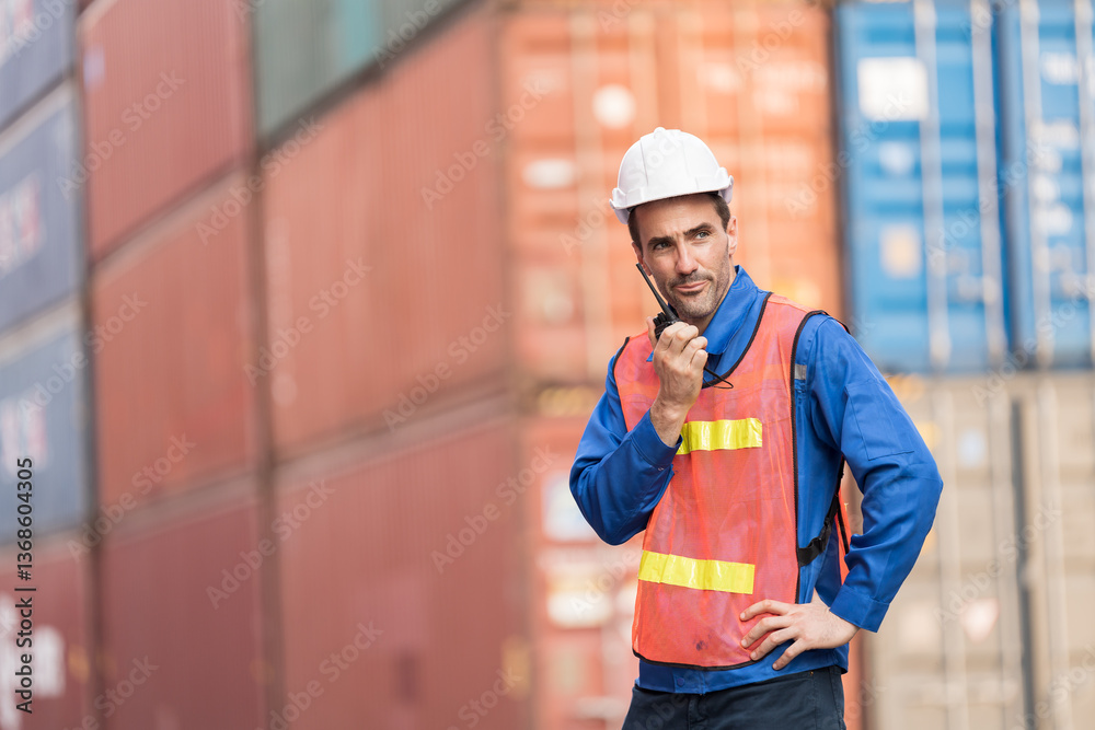 Import and export container, Worker inspecting and control of container. Male worker working and managing container at container yard Import and export container, Worker inspecting and control of container. Male worker working and managing container at container yard