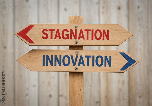 Signpost showing stagnation innovation directions on wooden background. Arrow sign with stagnation and innovation pointing in opposite directions representing business decisions