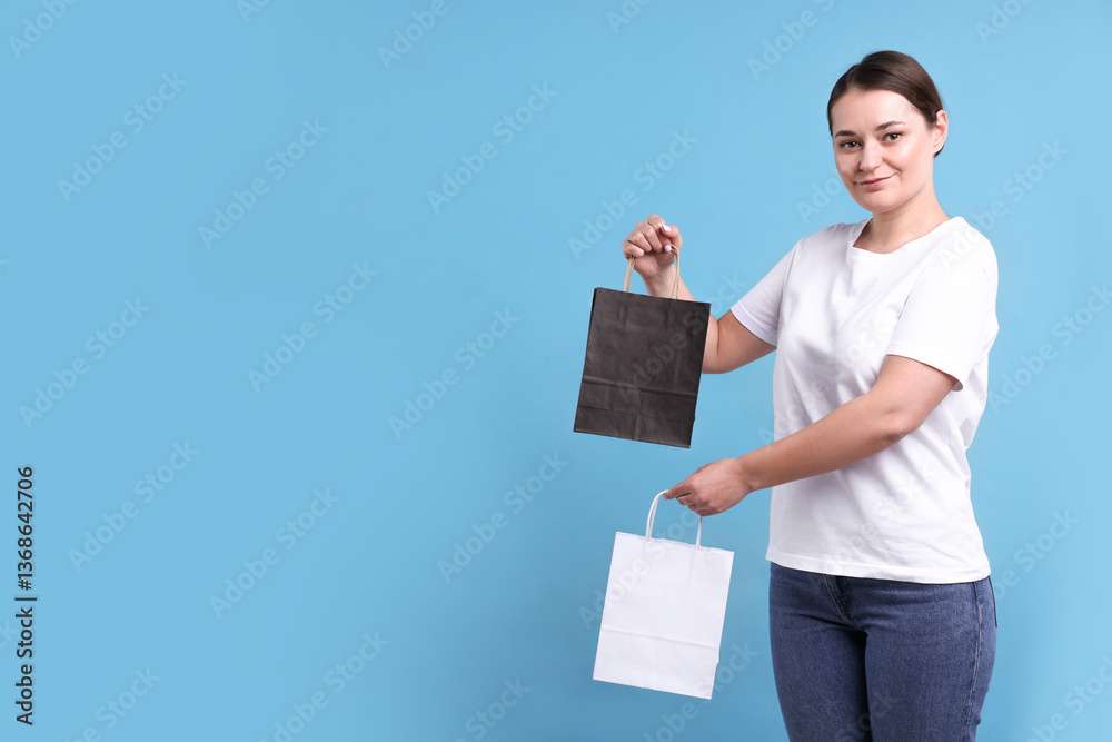Woman with blank items for branding on light blue background. Mockup for design Woman with blank items for branding on light blue background. Mockup for design