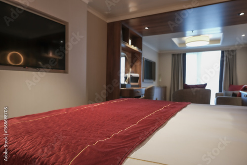 Obraz na płótnie Luxurious mini suite stateroom cabin room onboard luxury cruise ship cruiseship ocean liner with bedroom and living area in red and creme with wood in modern Art Deco interior design w salonie