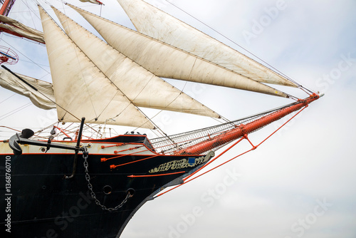 Old-fashioned sailing regatta with stretched sails - detail. Copy space.