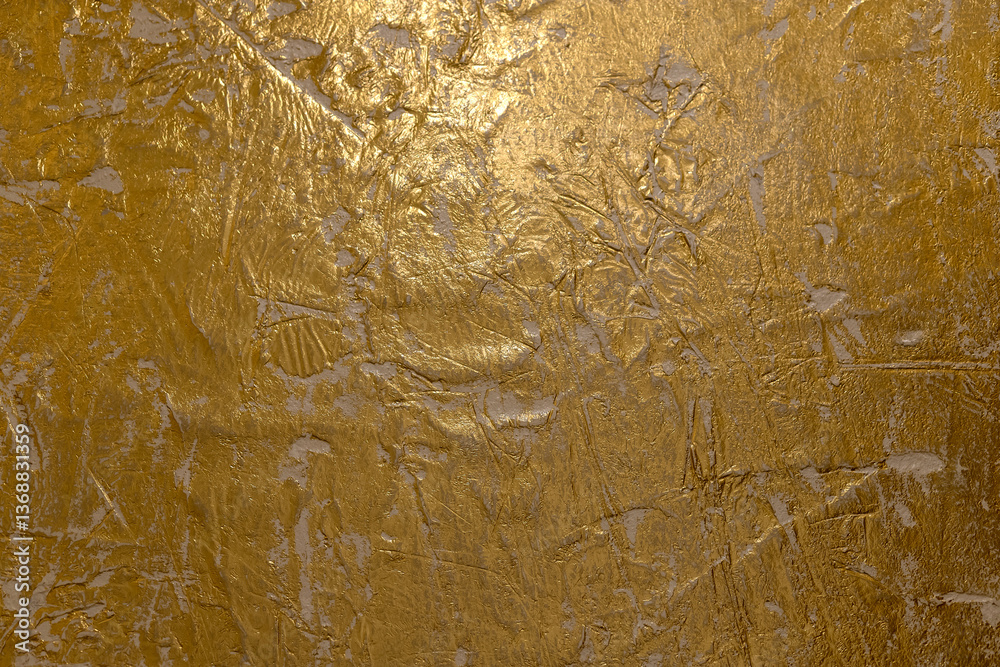 Abstract Textured Gold Venetian plaster Surface with Shimmering Highlights.