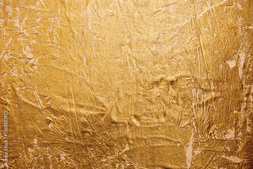 Textured golden stucco background with scratches