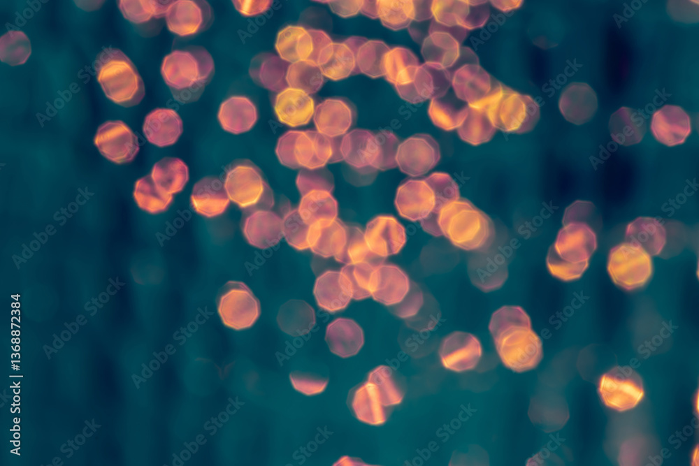 Abstract Golden Bokeh Light Pattern on a Soft Blue Background