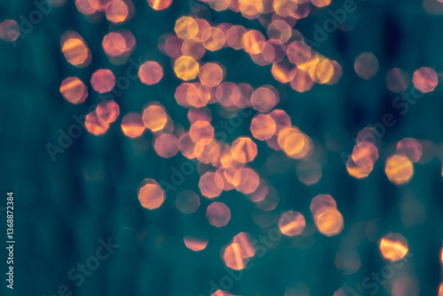 Obraz na płótnie Abstract Golden Bokeh Light Pattern on a Soft Blue Background w salonie