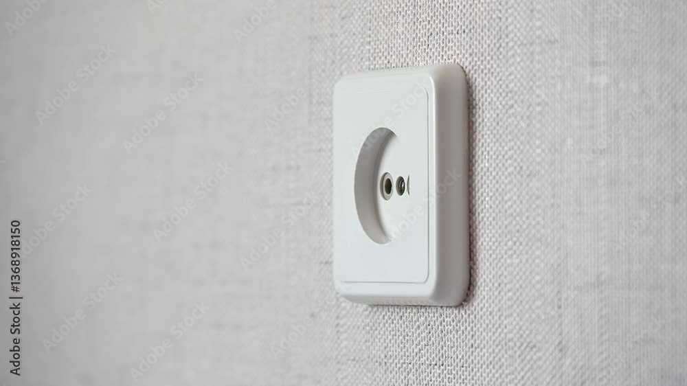 video in 4K format, plug is inserted into the socket and removed, connecting the phone, charging gadgets, turning on home appliances