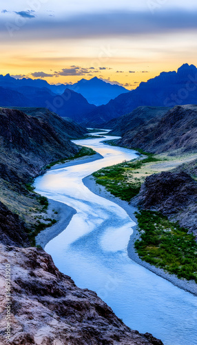 Serpentine river meandering through a majestic canyon at sunset