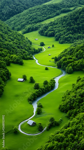 Serpentine river meanders through lush green valley, past small cottages