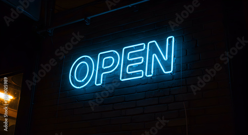 Illuminated invitation: Captivating neon sign announces openness on brick facade