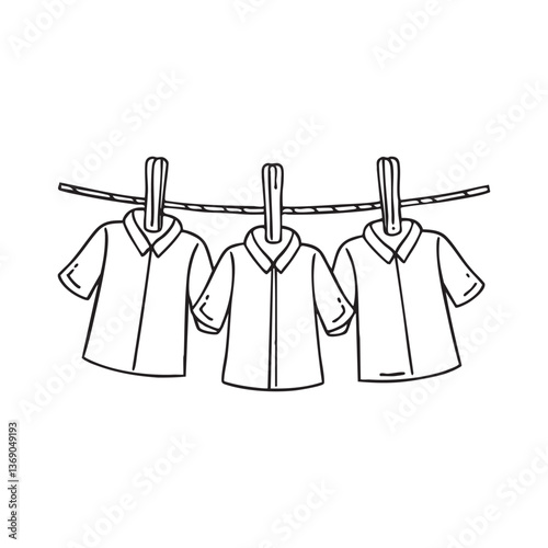 Wooden pegs holding shirts on a clothesline