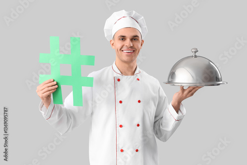 Happy male chef with hashta...