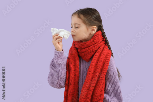 Sick little girl with tissu...