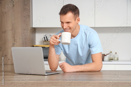 Young man with cup of hot t...