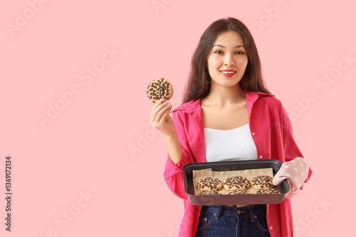 Young Asian woman holding b...