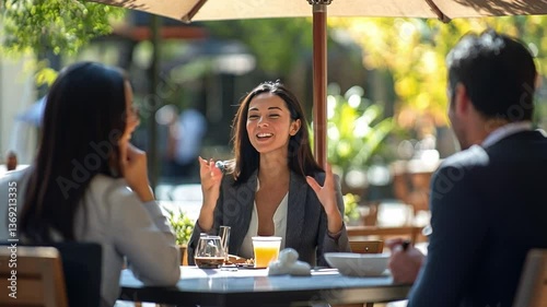 Outdoor Cafe Conversation: A group of professionals engages in a lively conversation at an outdoor cafe, enjoying the ambiance and each other's company.